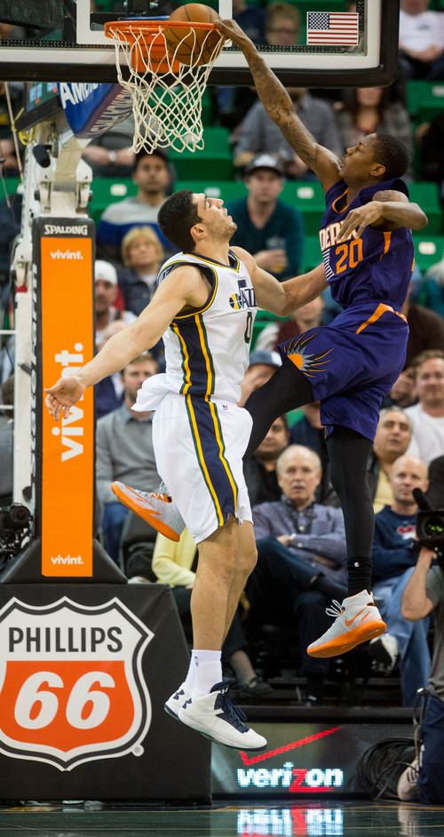 Trent Nelson  |  The Salt Lake Tribune
Phoenix Suns shooting guard Archie Goodwin (20) dunks over Utah Jazz center Enes Kanter (0) as the Utah Jazz host the Phoenix Suns, NBA Basketball in Salt Lake City, Wednesday, February 26, 2014.