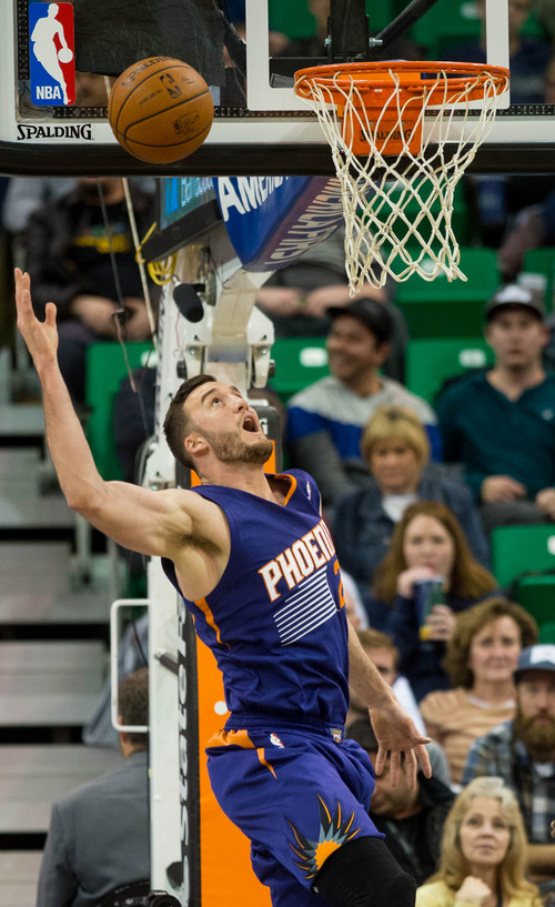 Trent Nelson  |  The Salt Lake Tribune
Phoenix Suns center Miles Plumlee (22) tries to recover a botched dunk as the Utah Jazz host the Phoenix Suns, NBA Basketball in Salt Lake City, Wednesday, February 26, 2014.