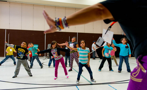 Trent Nelson  |  The Salt Lake Tribune
Pamela Pea leads a Zumba class at the Rose Park Academy in Salt Lake City, Thursday, February 27, 2014. Rose Park Academy is a very successful, robust, and unique afterschool program designed to educate the whole child. It is a college preparatory program offering classes such as cooking, soccer, guitar, basketball, chemistry, anatomy, Spanish, visual arts, dance, Zumba, piano, Design Thinking, mad science, and more.