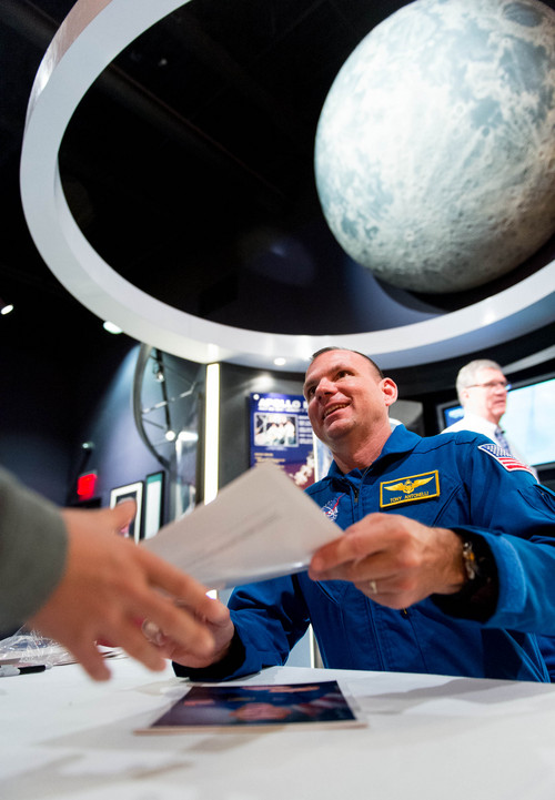 Trent Nelson  |  The Salt Lake Tribune
NASA astronaut Tony Antonelli signs photos at the Clark Planetarium in Salt Lake City, Thursday, February 27, 2014.