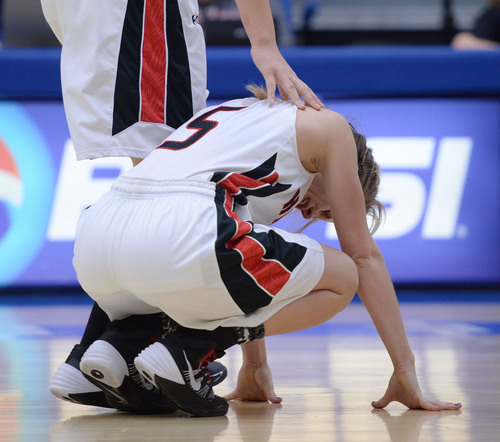 Steve Griffin  |  The Salt Lake Tribune


Alta's Rachel Jenson is comforted by a teammate after American Fork's Jenna Shepherd nailed a three-pointer, with no time left on the clock, to defeat Alta, during 5A semifinal basketball game between American Fork and Alta at SLCC Bruin Arena/Lifetime Activities Center in Taylorsville, Utah Friday, February 28, 2014.