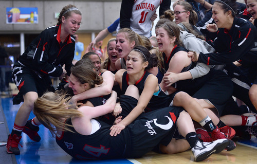 Steve Griffin  |  The Salt Lake Tribune


American Fork's Jenna Shepherd, second from bottom, gets pushed to the floor as her teammates pile on her after she nailed a three-pointer, with no time left on the clock, to defeat Alta, during 5A semifinal basketball game between American Fork and Alta at SLCC Bruin Arena/Lifetime Activities Center in Taylorsville, Utah Friday, February 28, 2014.