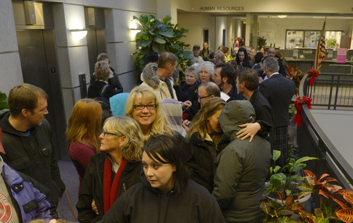 Steve Griffin  |  The Salt Lake Tribune


Couples wait in line to get their marriage license at the Weber County Clerk's Office in Ogden, Utah Monday, December 23, 2013.