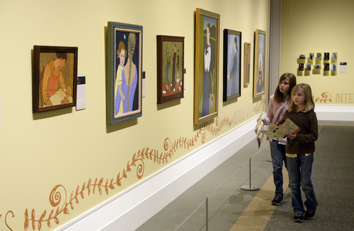 Francisco Kjolseth  |  The Salt Lake Tribune
Sisters Ellie Lever, 11, left, and Meg, 9, of Layton overlook the new exhibit at the Church History Museum titled "Practicing Charity: Everyday Daughters of God." The seven-month exhibition features the works of three Latter-day Saint artists: Lee Bennion, Brian Kershisnik, and Kathy Peterson. The artists were chosen because their pieces honor women, highlighting the joy in life's small moments.