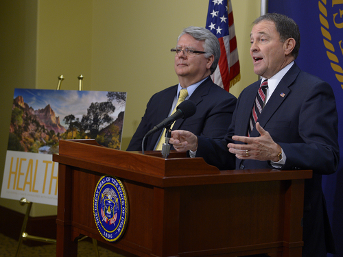 Scott Sommerdorf   |  The Salt Lake Tribune
Utah Governor Gary Herbert, along with Dr. W. David Patton, of the Utah Department of Health, at left, announced that he will choose to reject full medicaid expansion, and instead seeks a block grant to help cover poorest Utahns, Thursday, Feb. 27, 2014.