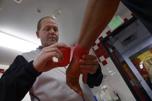 Scott Sommerdorf   |  The Salt Lake Tribune
Utah trainer Trevor Jameson wraps Princeton Onwas' wrist, Thursday, Feb. 27, 2014. Jameson is battling a rare form of bone marrow cancer, and in the months ahead will need a bone marrow transplant.