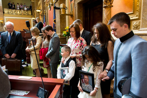 Trent Nelson  |  The Salt Lake Tribune
A moment of silence takes place in the House Chamber to honor the memory of Utah's fallen soldiers, at the State Capitol Building in Salt Lake City, Friday, February 28, 2014. The family of 1st Sgt. Tracy Stapley is at far right (Antionette, Kennedy and Tracy). At center is the family of Sgt. Shawn Martin Nelson (Hayden, Jodie and Ken).