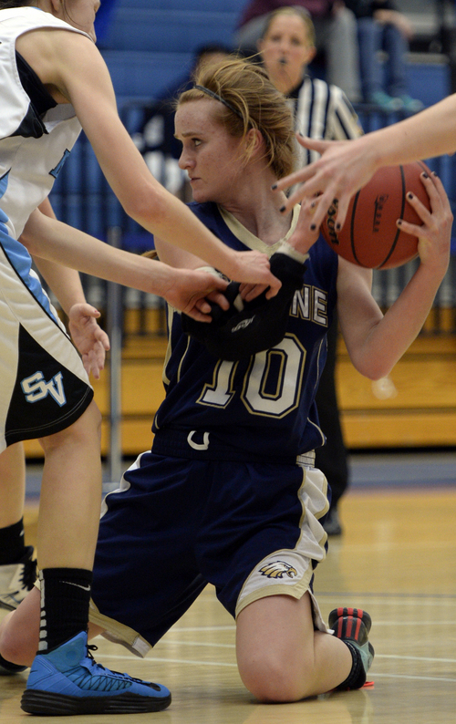 Rick Egan  | The Salt Lake Tribune 

Mia Mortensen (10), Skyline, is called for traveling as she grabs a loose ball, in prep girls state basketball action, Skyline vs. Sky View, Monday, February 24, 2014.