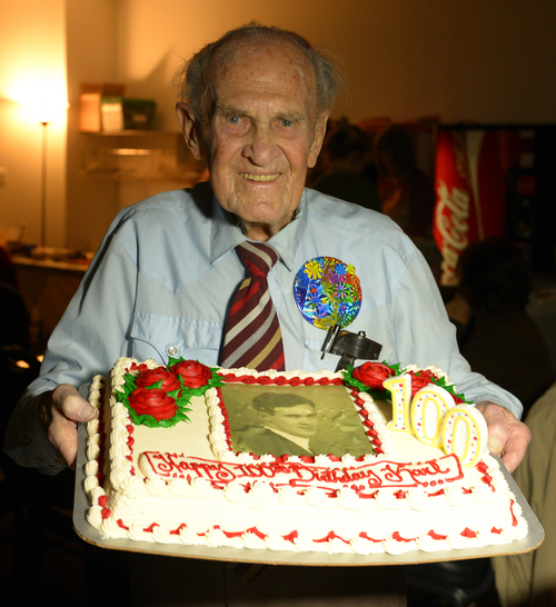 Rick Egan  | The Salt Lake Tribune 

Karl Tinggaard celebrates his 100th birthday at the Heritage Center in Murray, where he dances every Thursday, on Thursday, February 27, 2014.