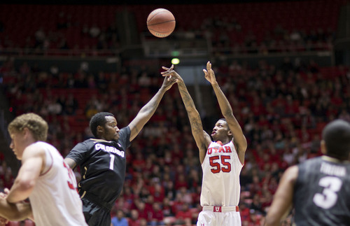 Lennie Mahler  |  The Salt Lake Tribune
Utah's Delon Wright shoots over Colorado's Wesley Gordon in the first half of a game at the Huntsman Center, Saturday, March 1, 2014.