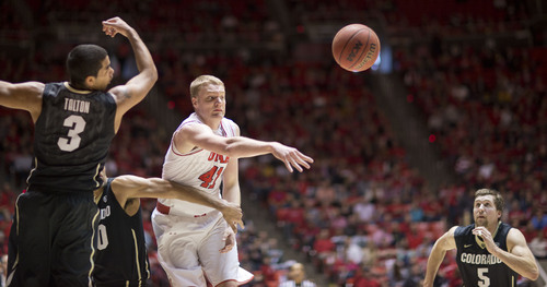 Lennie Mahler  |  The Salt Lake Tribune
Utah's Jeremy Olsen swats at a rebound as Colorado's Xavier Talton and Eli Stalzer rush to gain possession in the first half of a game at the Huntsman Center, Saturday, March 1, 2014.