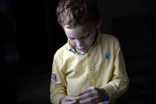 Francisco Kjolseth  |  The Salt Lake Tribune
A small Pokemon figure is all that James Turner can focus on for a moment, a reward for answering a simple vocabulary question as he works with therapist, Jeremy Smith at home. The Stansbury Park boy has autism and is one of 300 children in Utah's autism treatment "lottery."