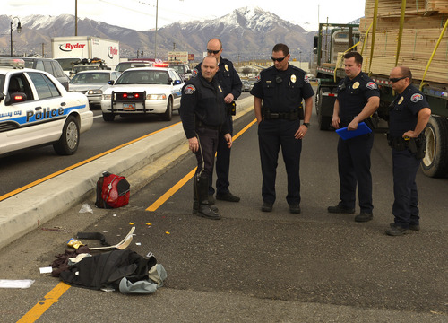 Rick Egan  | The Salt Lake Tribune 

West Valley police investigate an auto pedestrian accident on 3500 South and Redwood Road in West Valley City, Monday, March 3, 2014.