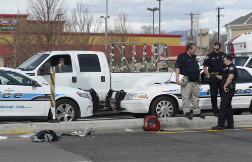 Rick Egan  | The Salt Lake Tribune 

West Valley police investigate an auto pedestrian accident on 3500 South and Redwood Road in West Valley City, Monday, March 3, 2014.