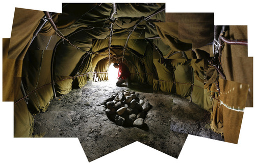 Francisco Kjolseth  |  Tribune file photo
Photo composite of the inside of the sweat lodge erected at the VA Hospital in Salt Lake, medicine man, Arnold Thomas who is completely blind feels around for debris in preperation for a ceremonial sweat. The buffalo style sweat lodge, built to represent the rib cage of a buffalo, is meant to transcend participants to birth and the womb and being born out of darkness.