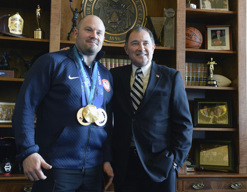 Al Hartmann  |  The Salt Lake Tribune 
Park City olympian Steve Holcomb stops in at Governor Gary Herbert's office Monday March 3 to show him his two bronze medals he won at the Sochi Olympics.   He also had his gold medal from Vancouver 2010 Olympics.  He was pilot for the two-man and four-man bobsled teams.