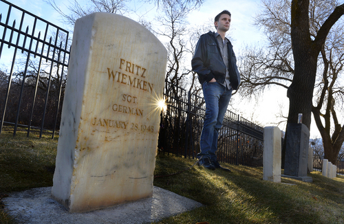 Scott Sommerdorf   |  The Salt Lake Tribune
Scott Porter is making a film about German WWII POWs held in Utah. He walks through the cemetery at Fort Douglas where many are buried, Friday, Feb. 28, 2014.
