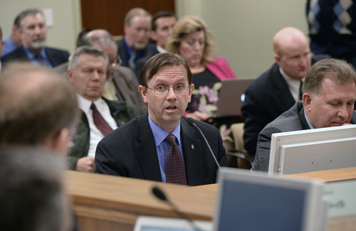 Al Hartmann  |  The Salt Lake Tribune 
Former Utah legislator Fred Cox testifies in the House Government Operation Standing Committee Monday March 3, 2014, on SB54, Elections Amendments sponsored by Senator Curtis Bramble at right.  The amended bill passed unananimously in the committee.   Many on the committee had reservations but voted for the so-called "Utah count my vote" compromise bill.