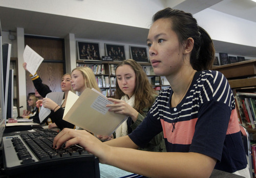 Al Hartmann  |  The Salt Lake Tribune
Cottonwood High School senior Tammy Tran applies online to Westminster College. Finding ways to help pay for college is an important step for many parents.