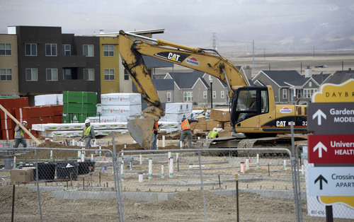 Al Hartmann  |  The Salt Lake Tribune 
Daybreak in South Jordan is one of Utah's fastest growing communities. Several major construction projects are underway just south of the community's SoDa Row commercial sector. As part of its sustainable master plan, Kennecott's mixed-use development emphasizes offering a wide mix of housing types, ranging from apartments, condominiums and apartments to single-family homes in a variety of sizes and prices.