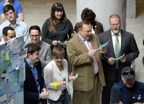 Francisco Kjolseth  |  The Salt Lake Tribune
Senators Jim Dabakis, D-Salt Lake City, second from right, and Stephen Urquhart, R-St. George, to his right, sing Katy Perry's song Roar as supporters of SB100 that would prohibit discrimination based on sexual orientation rally at the Utah State Capitol  on Wednesday, March 5, 2014. Though polls indicate a majority of Utahns support the idea, legislative leaders have said they won't hear any bills related to lesbian, gay, bisexual and transgender issues this year, including other proposals less friendly to the LGBT community as the state defends its ban on gay marriage in court.
