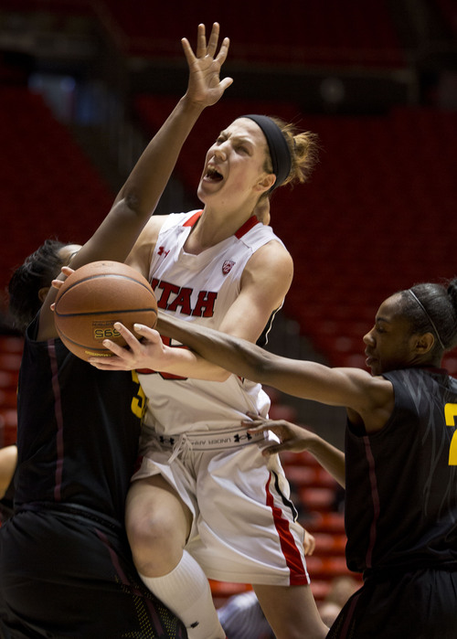 Lennie Mahler  |  The Salt Lake Tribune
Michelle Plouffe draws a foul in the first half of a game at the Huntsman Center on Sunday, Jan. 20, 2013. The Utes defeated the Sun Devils 66-46.