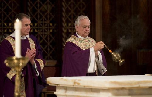 Lennie Mahler  |  The Salt Lake Tribune
Deacon Lynn Johnson and the Rev. Martin Diaz participate in the Ash Wednesday ceremony at the Cathedral of the Madeleine, March 5, 2014, in Salt Lake City.