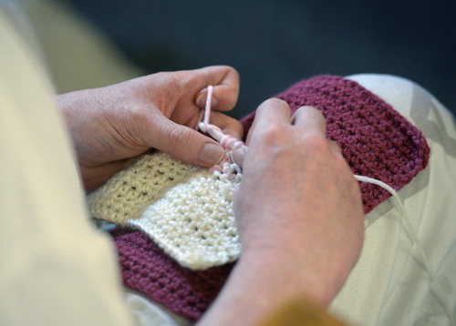 Al Hartmann  |  The Salt Lake Tribune 
An inmate at the Utah State Prison in Draper knits in the quiet setting of the Oquirrh Chapel Wenesday March 5.