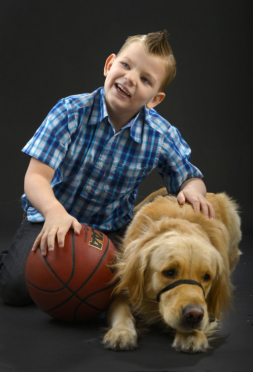 Leah Hogsten  |  The Salt Lake Tribune
Porter Holmes, 6, has a constant companion in Thumper, his service dog of one year to help with his seizures stemming from Dravet syndrome.