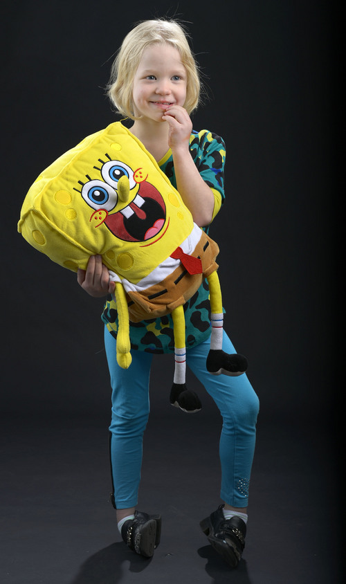 Leah Hogsten  |  The Salt Lake Tribune
Charley Grossman, 7, rarely leaves home without her Spongebob Squarepants stuffed doll. Charley, the youngest of four siblings has Intractable Epilepsy and seizes multiple times every day.