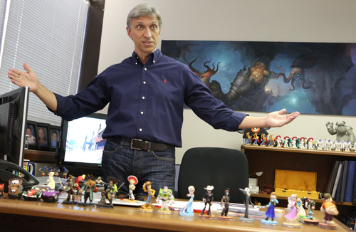 Francisco Kjolseth  |  The Salt Lake Tribune
Jeff Bunker, studio art director for Avalanche Software, Disney's video game development house, expresses his excitement over the unveiling of "Infinity," which is a mash up of games incorporating many of Disney's characters " Disney is laying off 700 people from the interactive unit that makes video games and operates websites, about a quarter of the workforce in the division. According to a source within the studio, none of the layoffs were expected to occur at Disney Interactive's Salt Lake City studio, Avalanche Software, which is currently producing the popular "Disney Infinity" video game. "Infinity" uses popular Disney characters in the game and also involves plastic figurines of the characters that unlock gaming content.
