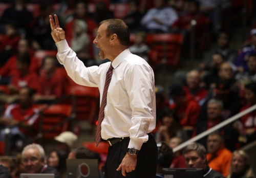 Kim Raff  |  The Salt Lake Tribune
University of Utah head coach Larry Krystkowiak calls a play on the sidelines during a game against College of Idaho at the Huntsman Center in Salt Lake City on December 28, 2012.