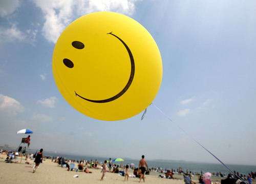 Michael Dwyer  |  Associated Press file photo
A smiley face balloon floats over Revere Beach in Revere, Mass. as beachgoers head for the water in 2006. A survey co-hosted by The Salt Lake Tribune is looking for nominations for businesses that allow and encourage employees to work happy.