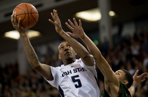 Trent Nelson  |  The Salt Lake Tribune
Utah State Aggies forward/center Jarred Shaw (5) shoots the ball as Utah State University hosts Colorado State, NCAA basketball, Wednesday January 15, 2014 in Logan.