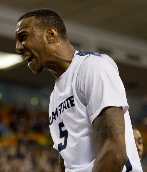 Trent Nelson  |  The Salt Lake Tribune
Utah State Aggies forward/center Jarred Shaw (5) yells after a score as Utah State University hosts Colorado State, NCAA basketball, Wednesday January 15, 2014 in Logan.