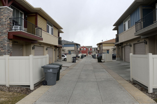 Al Hartmann  |  The Salt Lake Tribune 
These twin homes in Daybreak, Kennecott's mixed use development in South Jordan, feature alleyways access to garages. This and other design elements  allows more connectedness between yards and living spaces in the front of the homes.