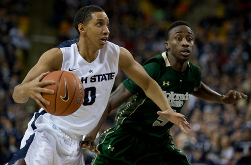 Trent Nelson  |  The Salt Lake Tribune
Utah State Aggies guard Marcel Davis drives the ball, defended by Colorado State Rams guard Jon Octeus (5) as Utah State University hosts Colorado State, NCAA basketball, Wednesday January 15, 2014 in Logan.