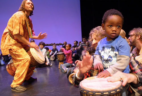 Rick Egan  | The Salt Lake Tribune 

 Andy Jones from Djembe Direct and the African Heartwood Project (left) teaches kids about African drumming, as Carolyn Miller drums with Qunicy Landau, 2, (right) during the "Ring Around the Rose" dance class at Rose Wagner Performing Arts Center, Saturday, March 8, 2014.