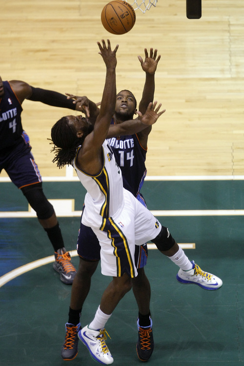 Chris Detrick  |  The Salt Lake Tribune
Utah Jazz small forward DeMarre Carroll (3) shoots past Charlotte Bobcats small forward Michael Kidd-Gilchrist (14) during the first half of the game at EnergySolutions Arena Friday March 1, 2013.