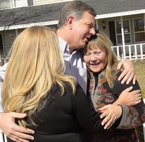 Rick Egan  | The Salt Lake Tribune 

Ken Drake hugs his birth mother Raella  Bodinus  (right) and his sister Robin Ramirez (left) for the first time, at his home in Lindon,  Friday, March 7, 2014. Drake was born in Los Angeles in 1964. He and his birth mother found each other through a DNA match on ancestry.com.