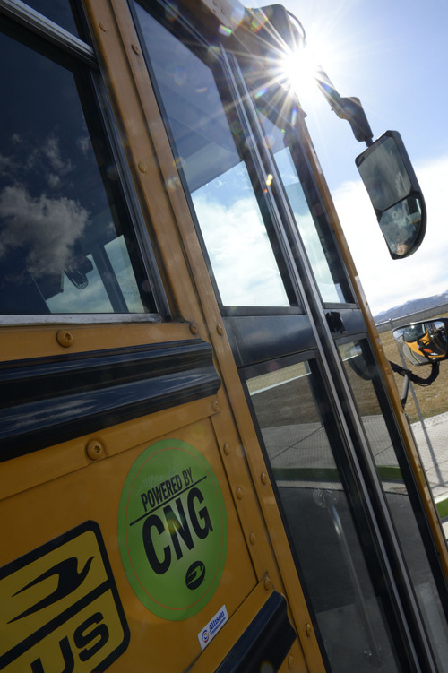 Francisco Kjolseth  |  The Salt Lake Tribune
A few school buses that run on compressed natural gas pull up to Sunset Ridge Middle school in West Jordan on Monday, March 3, 2014 before loading up with students for the trip home. Out of 21 buses that pulled up, three ran on compressed natural gas. The Jordan District has more CNG buses than any other in the state.