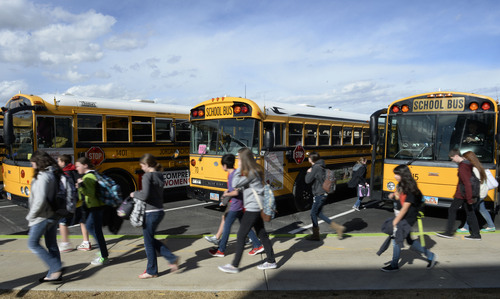 Francisco Kjolseth  |  The Salt Lake Tribune
Kids get ready to head home as they load onto their school buses at Sunset Ridge Middle school in West Jordan on Monday, March 3, 2014. Out of 21 buses that pulled up, three ran on compressed natural gas. The Jordan District has more CNG buses than any other in the state.