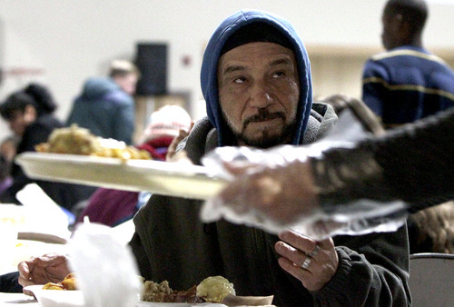 Leah Hogsten  |  The Salt Lake Tribune
Rafael Garcia is given a free meal Wednesday, December 25th. On Christmas Day, the Salt Lake City Rescue Mission served dinner to those in need at The Christian Life Center.