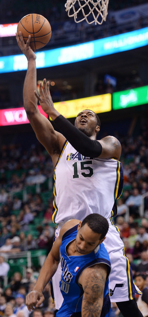 Steve Griffin  |  The Salt Lake Tribune


Utah Jazz power forward Derrick Favors (15) jumps over Dallas Mavericks guard Devin Harris (20) and lays the ball in during first half action in the Jazz versus Mavericks game at EnergySolutions Arena in Salt Lake City, Utah Wednesday, March 12, 2014.