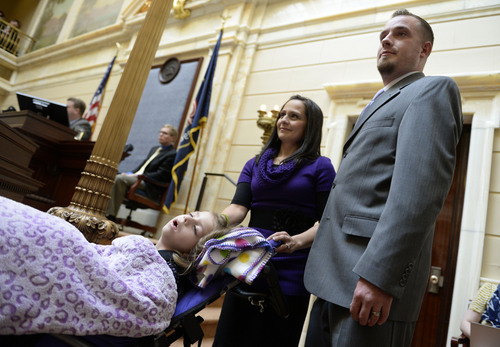 Francisco Kjolseth  |  The Salt Lake Tribune
Catrina and Jeff Nelson alongside their daughter, Charlee, 6, who suffers from Late Infant Batten Disease, a terminal inherited disorder of the nervous system. The family was acknowledged on the Senate floor at the Utah Capitol after senators unanimously passed HB105,which would provide access to cannabis oil for epileptic kids, on Tuesday, March 11, 2014.