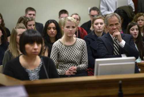 Scott Sommerdorf  |  The Salt Lake Tribune
Elizabeth Smart, center, along with her father Ed Smart, right listen to debate on HB286 in committee in February. The sponsor of the bill, Rep. Angela Romero, D-Salt Lake City, is at left.