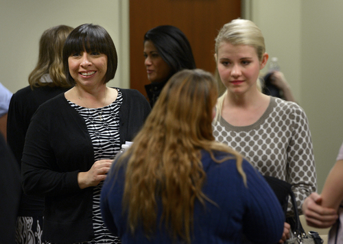 Scott Sommerdorf   |  The Salt Lake Tribune
As Elizabeth Smart, right, speaks with others who attended the committee meeting in February where HB286 - Child Sexual Abuse Prevention - was heard in committee, the sponsor of the bill, Rep. Angela Romero, D-Salt Lake City, speaks with attendees.