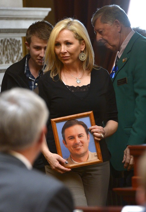 Leah Hogsten  |  The Salt Lake Tribune
Nannette Wride enters the Utah House with her son Tyesun and daughter KylieAnne to honor the life of her deceased husband Utah County Sheriff Cory Wride. The Utah House of Representatives passed a bill Wednesday, March, 12, 2014, to rename SR-73 in Utah County in honor of Wride, who was killed during a shootout along the highway in January.