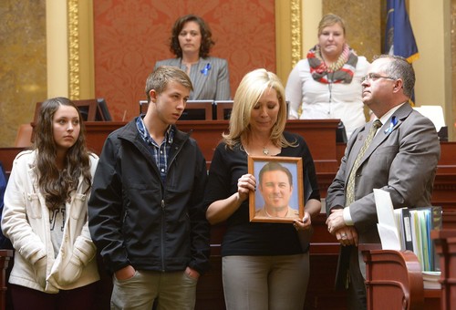 Leah Hogsten  |  The Salt Lake Tribune
l-r KylieAnne Wride, brother Tyesun and mother Nannette Wride were thanked by the Utah House and observed a moment of silence to honor the life of her deceased husband Utah County Sheriff Cory Wride. The Utah House of Representatives passed a bill Wednesday, March, 12, 2014, to rename SR-73 in Utah County in honor of Wride, who was killed during a shootout along the highway in January.
