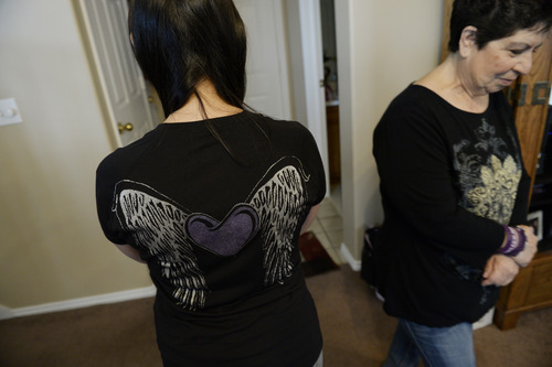 Francisco Kjolseth  |  The Salt Lake Tribune
Catrina Nelson of West Jordan shows off her Charlee's Angels wings alongside her mother Marcie Lucero in honor of her daughter Charlee, 6, who suffers from Late Infant Batten Disease, a terminal inherited disorder of the nervous system that leads to seizures, loss of vision and motor skills.
